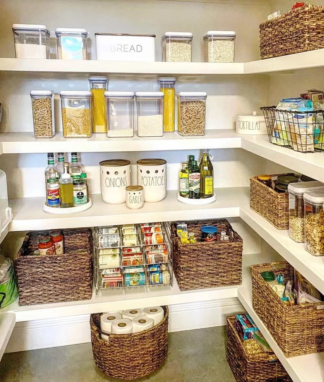 Luxury walk-in pantry ideas showcasing marble countertops and glass doors