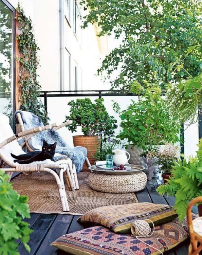 Brightly patterned pillows inviting relaxation in bohemian backyard ideas