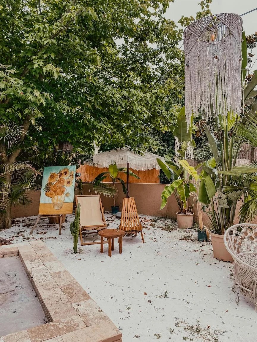 Colorful patterned rugs enhancing a bohemian backyard ideas ambiance